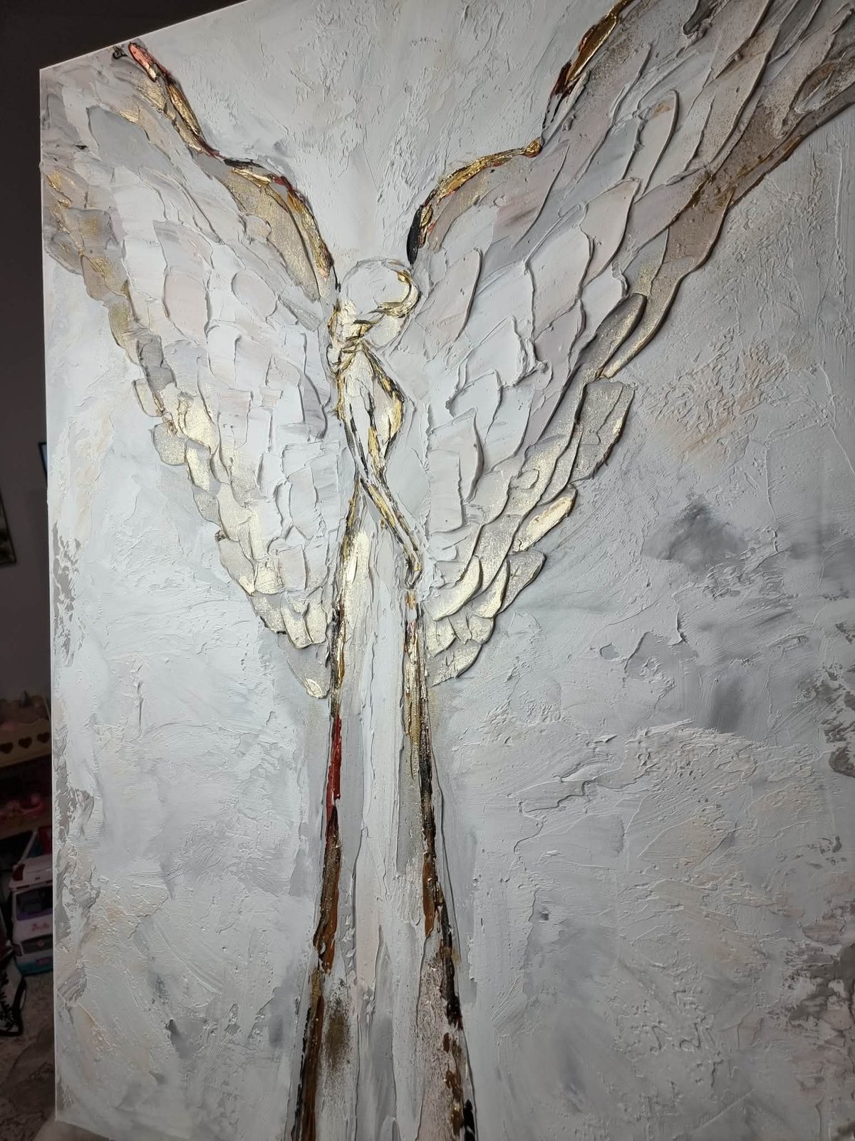 Textured painting of an angel figure with large white wings and flowing robes on a light neutral background