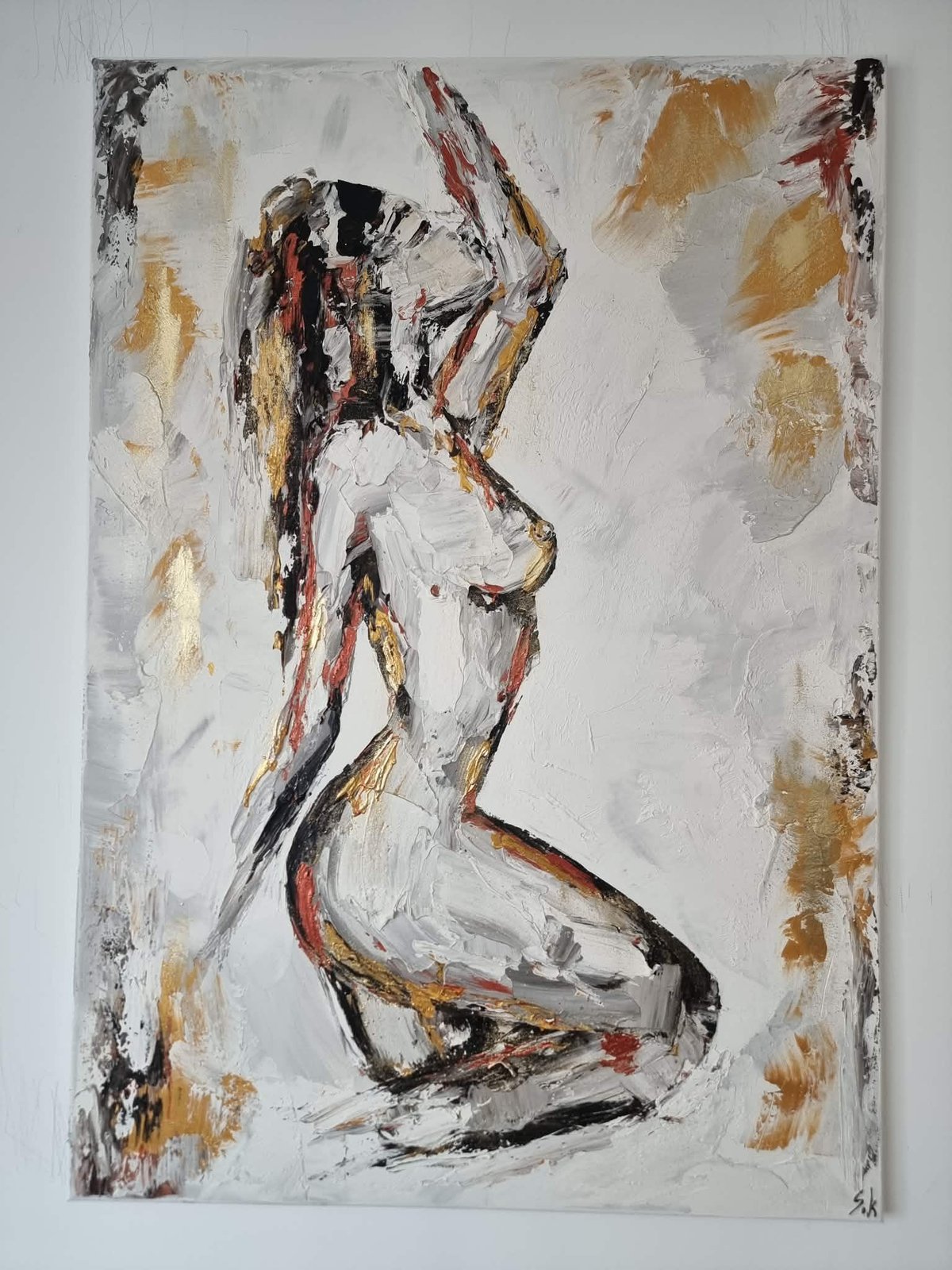 Abstract oil painting of a kneeling female figure in profile, rendered with bold black, gold, and red brushstrokes on white canvas