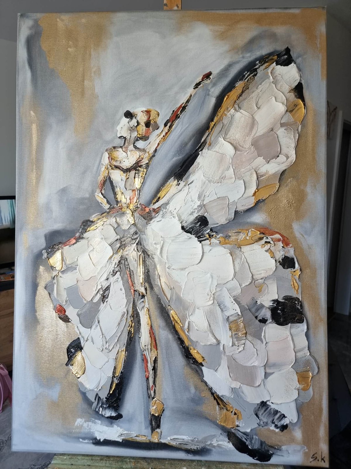 Abstract oil painting of a white butterfly with gold and black accents on a textured tan and gray background