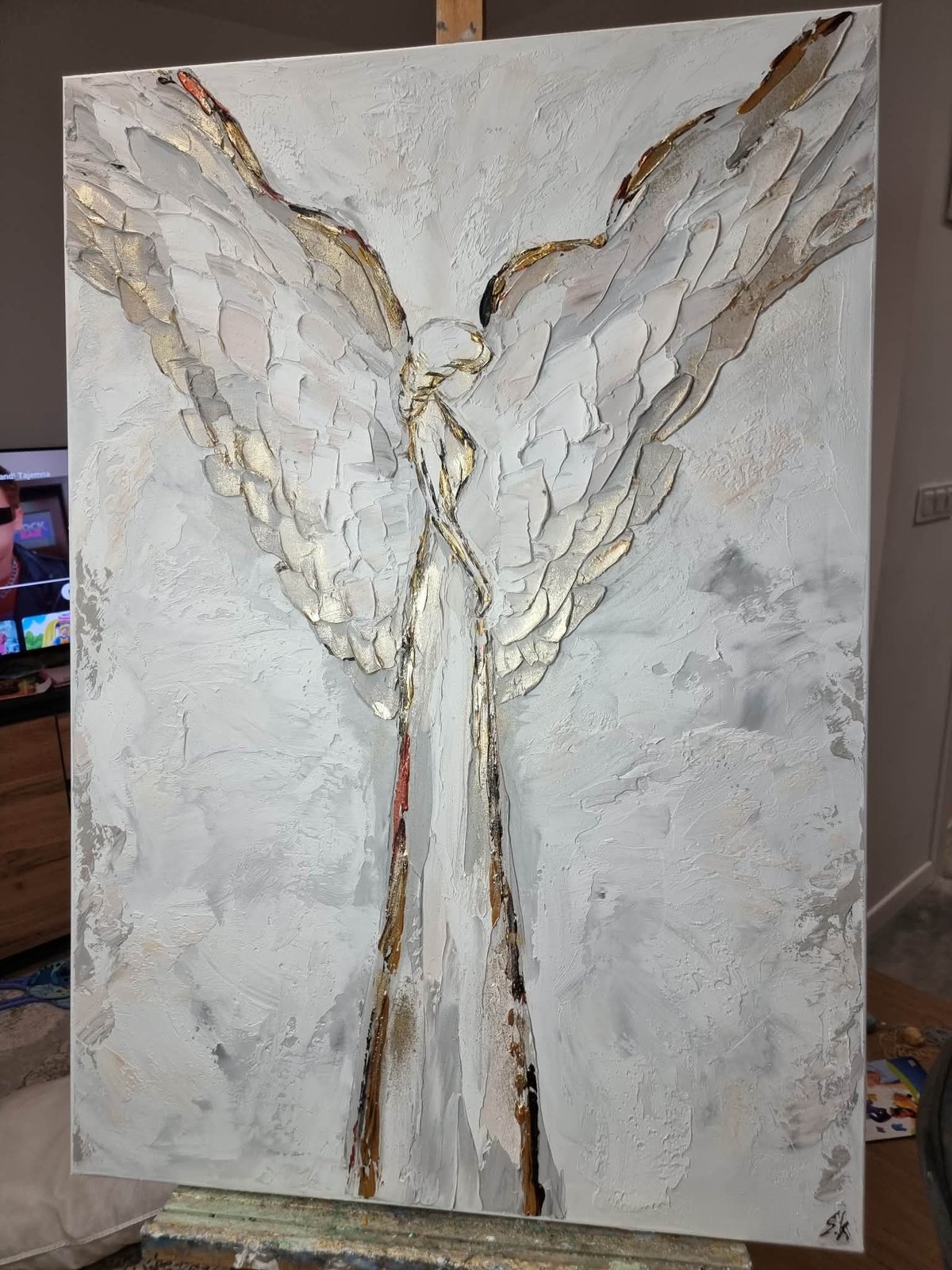 Abstract white and gold oil painting of an angel figure with large textured wings and flowing robes